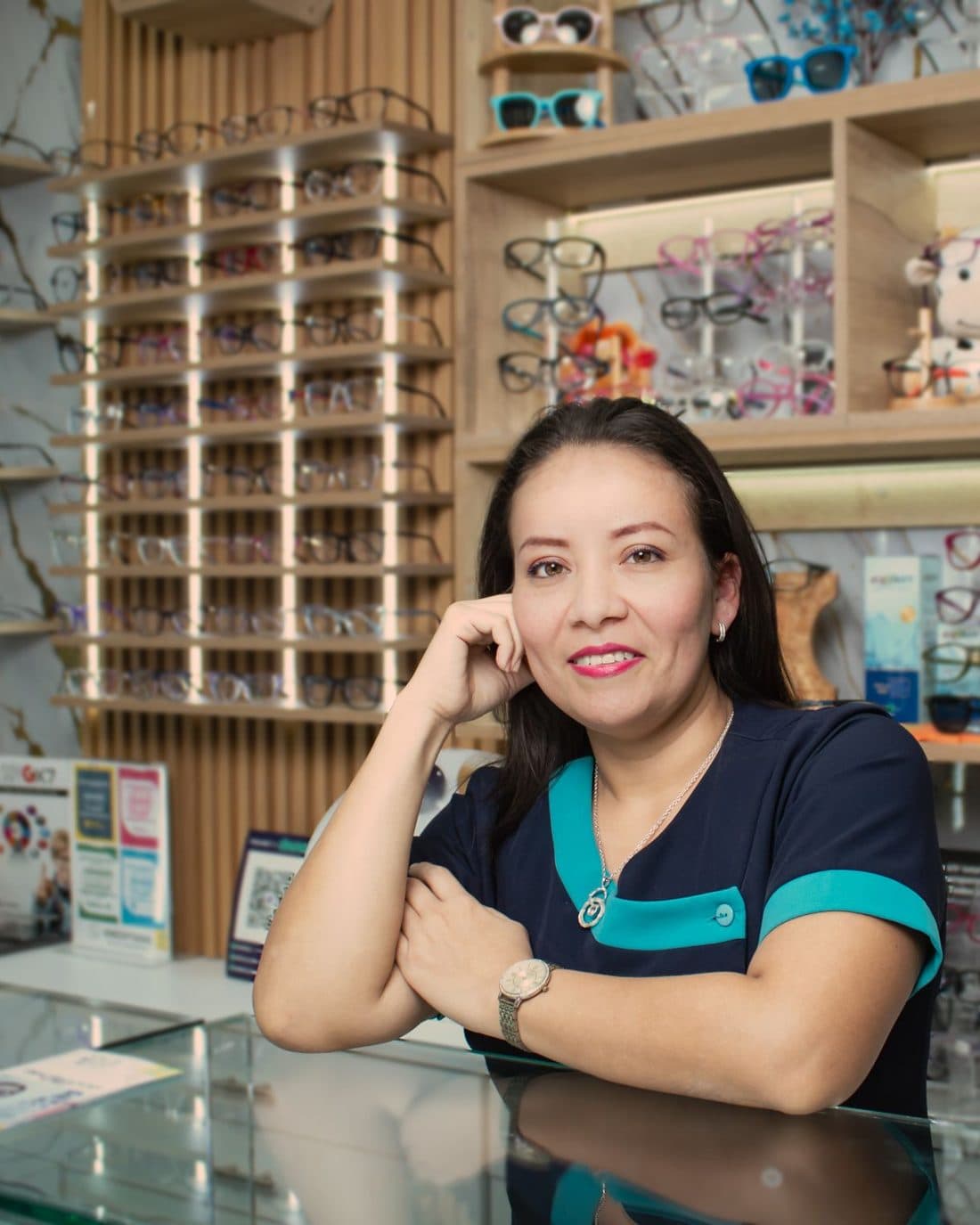 Optical store owner at her counter